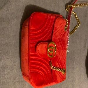 New Red Gucci purse with duster. Never used.